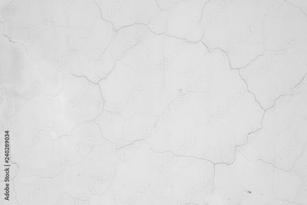 White concrete painted wall with cracks, texture