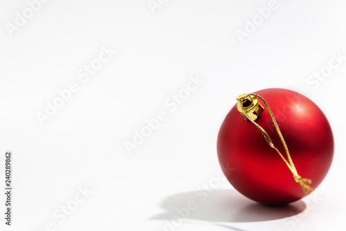 Red Christmas ball on a white background