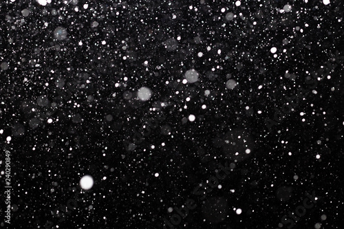 Snowfall on black background