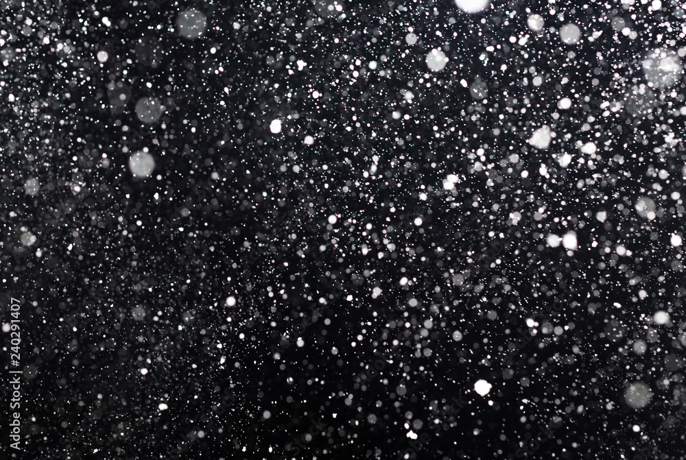 Obraz premium Snowfall on black background
