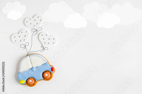 A photo of a typewriter flying on balloons. Greeting card for children, newborns. Children's banner. Form for text.