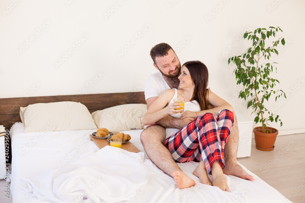 husband and wife morning breakfast in bed in the bedroom the family love