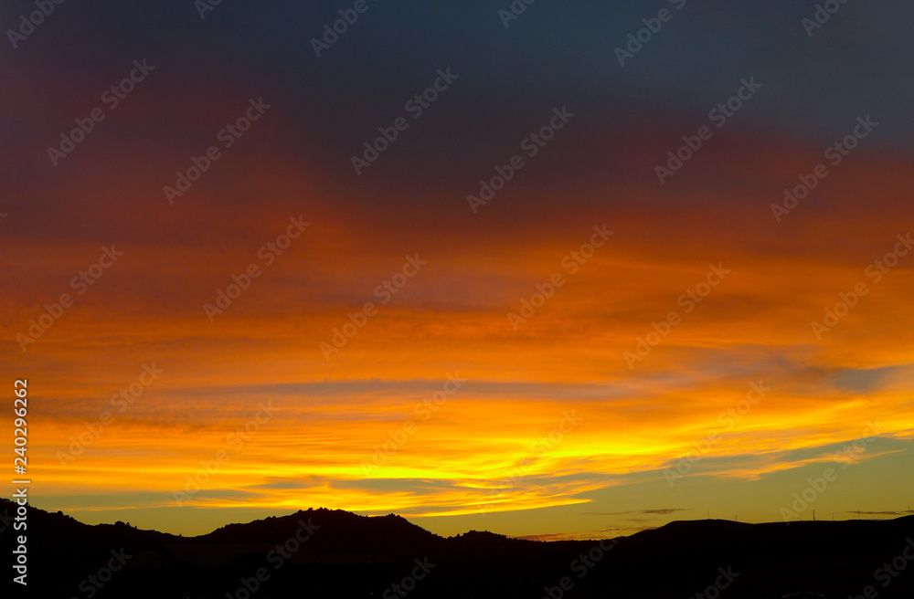 Brilliant pink sunset over the mountains in San Diego California