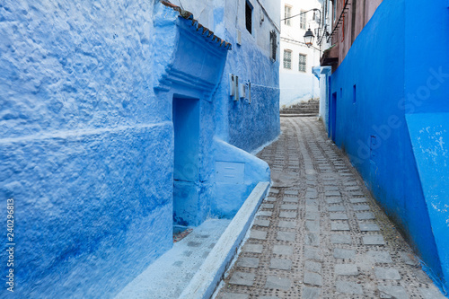 beautiful narrow street in blue city Chefchaouen in Morocco © sergejson