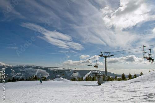 Famous ski resort in Czech Rupublic - Spindleruv Mlyn. People on mountain , the chairlift .