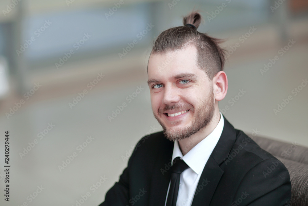 closeup. portrait of successful businessman on workplace in the office closeup. portrait of successful businessman on workplace in the office