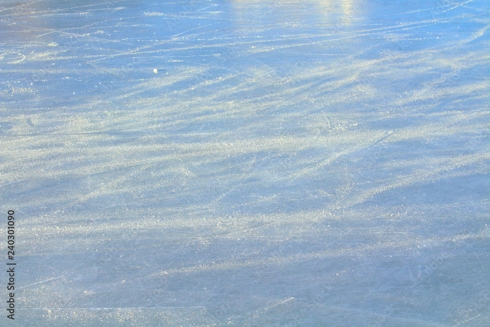 Ice rink with snow in the stadium. Close-up. Background. Texture. Ice rink with snow in the stadium. Close-up. Background. Texture.