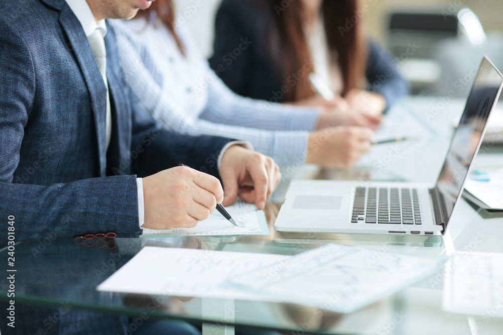 close up.businessman checking financial statements. business concept close up.businessman checking financial statements. business concept