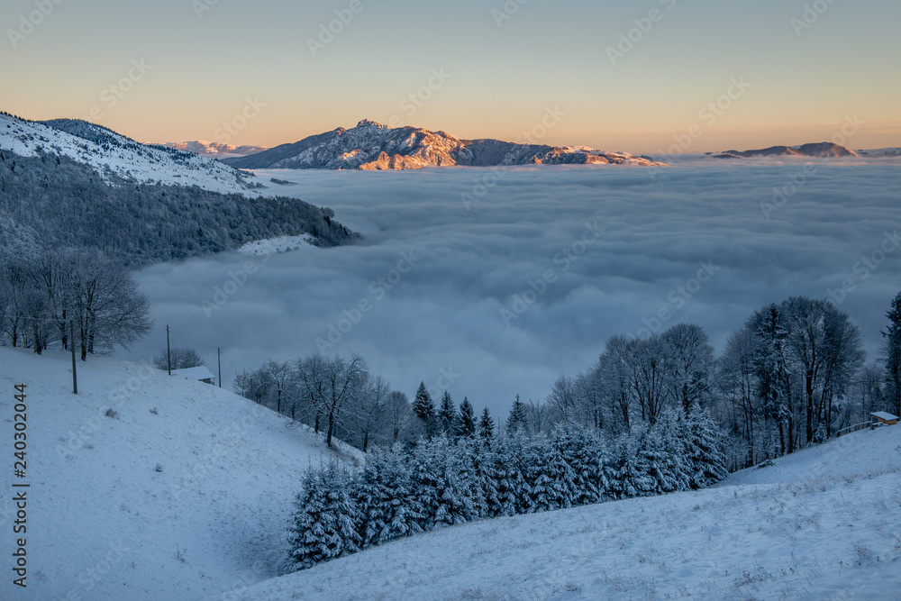 fog with mountains at sunset