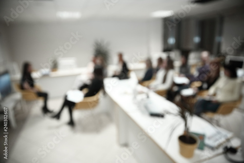 blurred image of a large modern office
