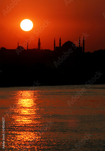 During the sunset historical peninsula and Hagia Sofia, Istanbul, Turkey. This picture was taken from the Kadikoy District.