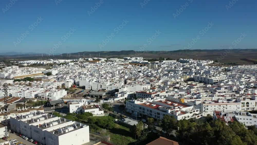 Conil de la Frontera Cadiz Spain aerial drone city flight over white buildings Conil de la Frontera Cadiz Spain aerial drone city flight over white buildings