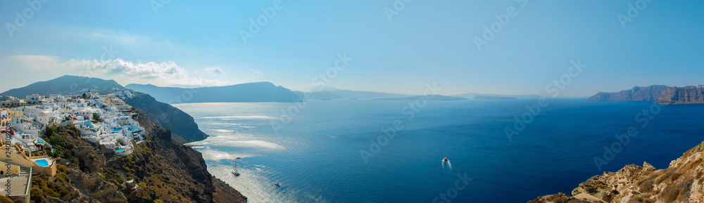 Panoramic view of the stunning Mediterranean Sea from the top of the caldera of Santorini Greece