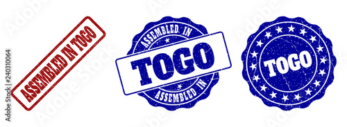 ASSEMBLED IN TOGO grunge stamp seals in red and blue colors. Vector ASSEMBLED IN TOGO marks with grunge effect. Graphic elements are rounded rectangles, rosettes, circles and text labels.