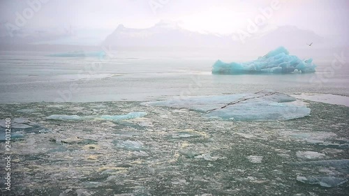 Iceberg and ice from glacier in arctic nature landscape on Iceland. Affected by climate change and global warming.