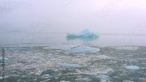 Iceberg and ice from glacier in arctic nature landscape on Iceland. Affected by climate change and global warming.