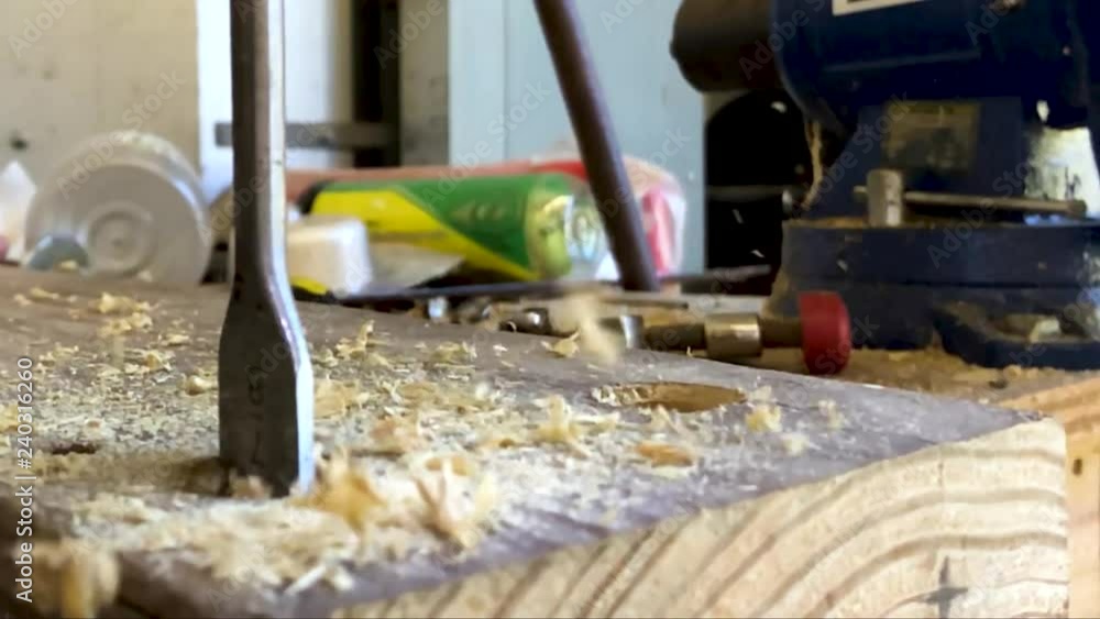 Slowmo close-up of hole being drilled in wood Slowmo close-up of hole being drilled in wood