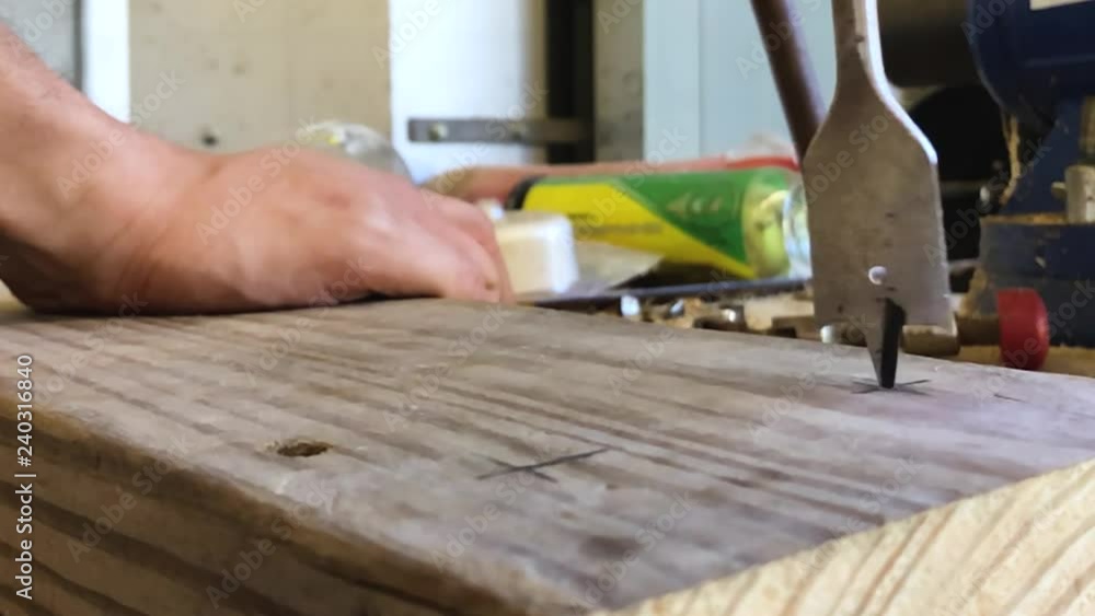 Slowmo close-up of hole being drilled in wood Slowmo close-up of hole being drilled in wood