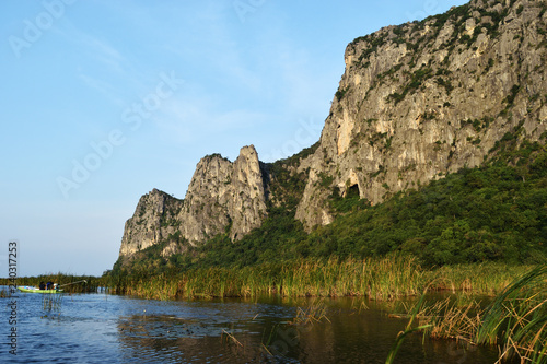 Rock cliff and green forest on limestone mountain on the vast wetland at Khao Sam Roi Yot National Park   Thailand 