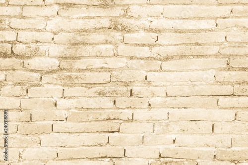 Cream colors and brown brick wall art concrete or stone texture background in wallpaper limestone abstract paint to flooring and homework Brickwork or stonework clean grid uneven interior rock old.