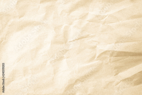 Brown background paper, crumpled texture and watercolor. Old vintage page with a glowing center and grunge vignette.