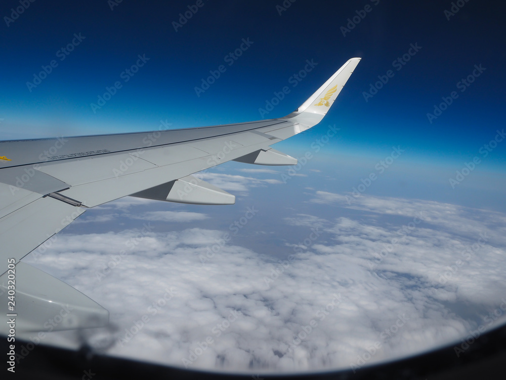Fototapeta premium Outside view of the plane through Asia