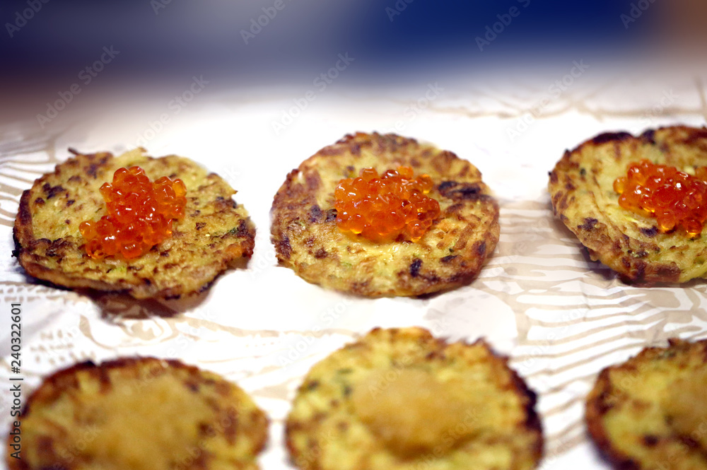 Macro photo of delicious potato pancakes with caviar Macro photo of delicious potato pancakes with caviar