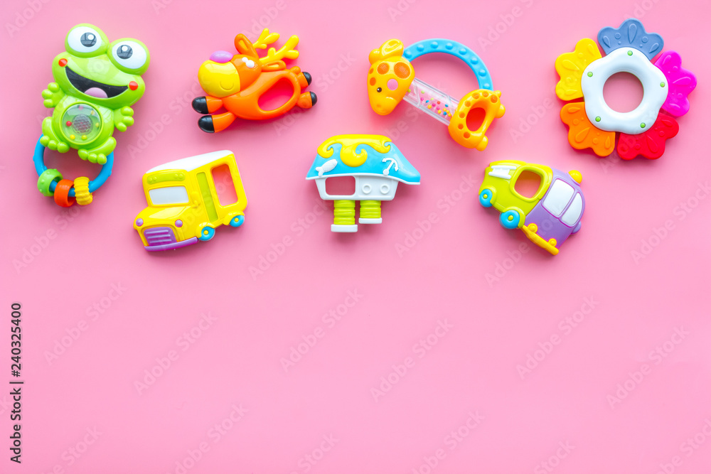 Handmade toys for newborn baby. Rattle. Pink background top view mockup Handmade toys for newborn baby. Rattle. Pink background top view mockup