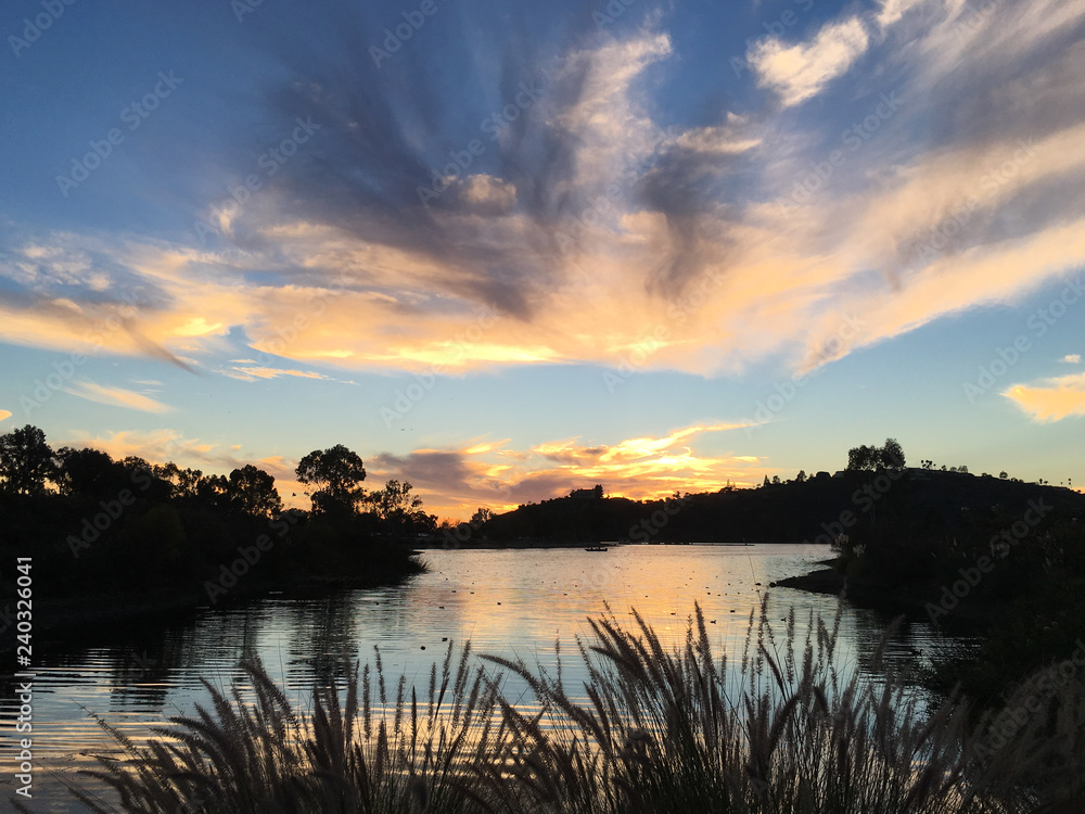 Beautiful sunset over a quiet Lake Murray in San Diego California