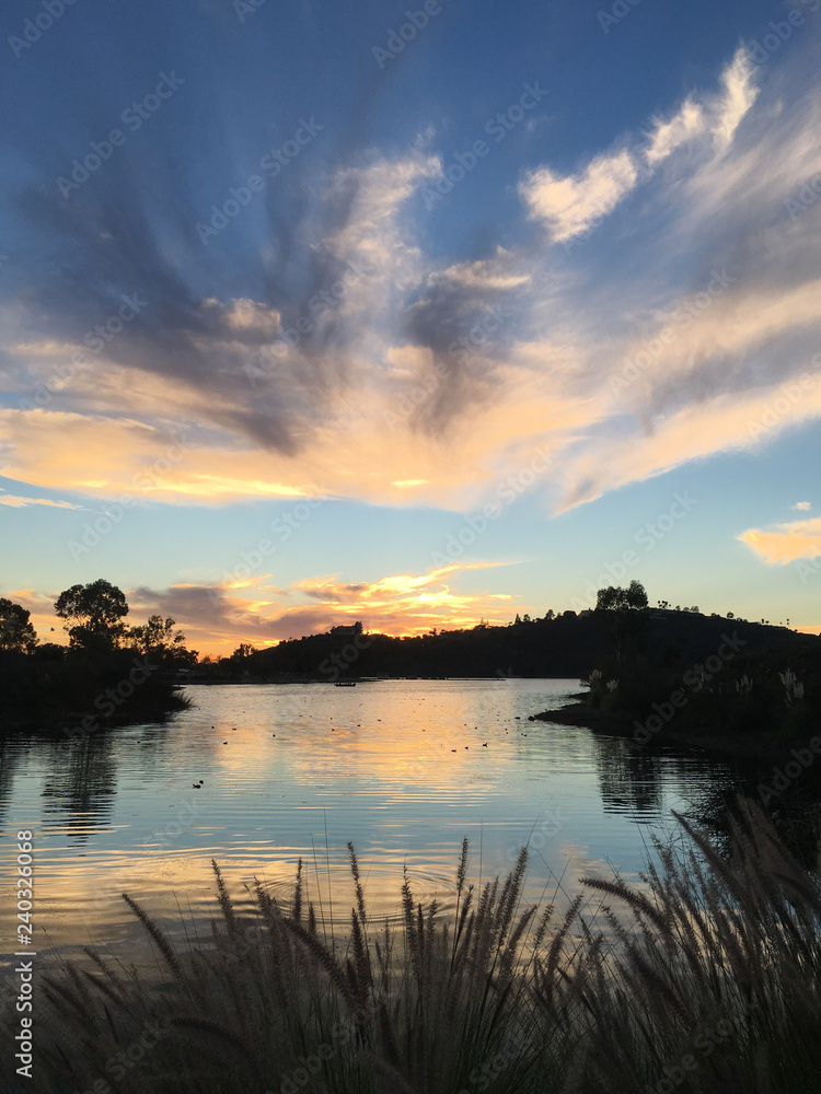 Beautiful sunset over a quiet Lake Murray in San Diego California Beautiful sunset over a quiet Lake Murray in San Diego California