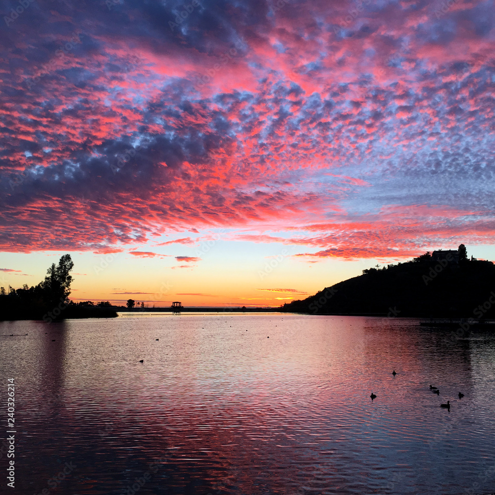 Beautiful sunset over a quiet Lake Murray in San Diego California Beautiful sunset over a quiet Lake Murray in San Diego California