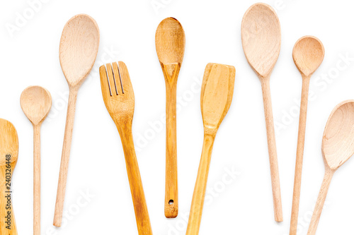 Village wooden cutlery set on white background top view