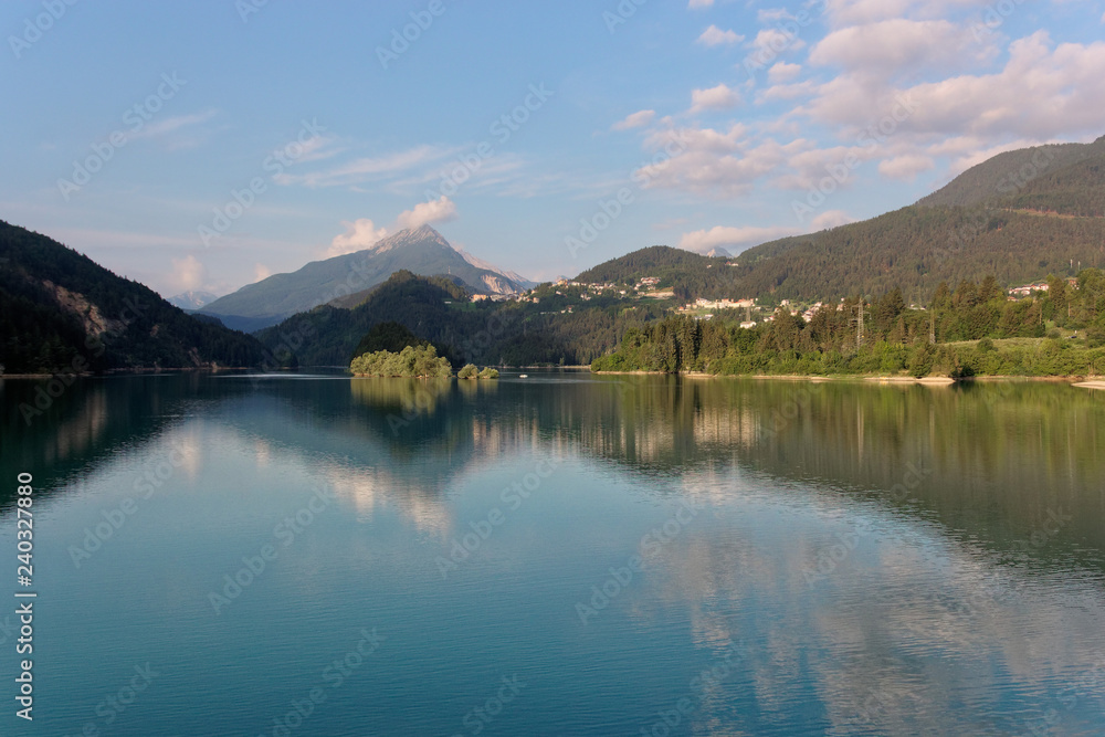 Domegio di Cadore, Italy Beautiful lake in the mountains at sunrise.