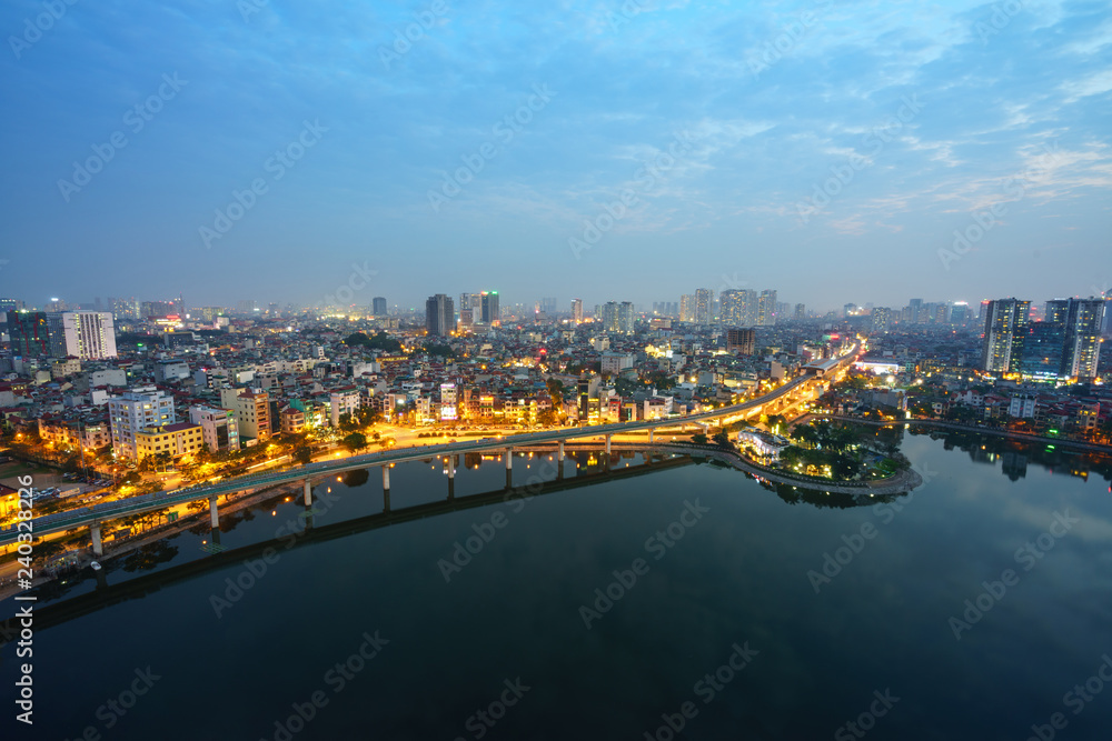 Fototapeta premium Aerial skyline view of Hanoi city, Vietnam. Hanoi cityscape by sunset period at Hoang Cau lake, Dong Da district