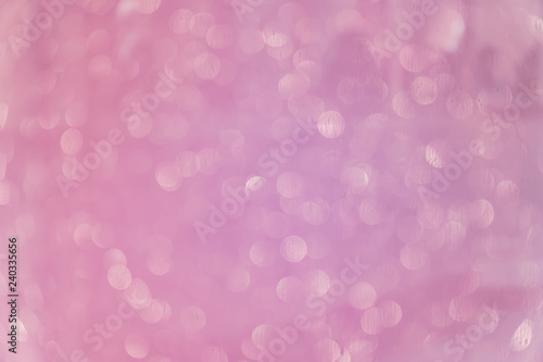 Bokeh abstract texture. Beautiful christmas background in purple colors. Defocused