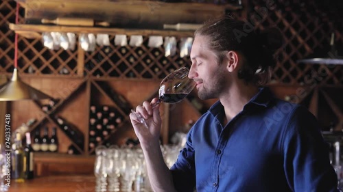 Wine Tasting. Man Smelling, Drinking Red Wine At Winery Cellar