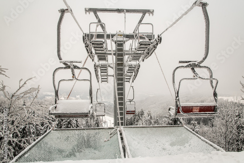 chair lift on Severka ski area in Moravskoslezske Beskydy mountains in Czech republic photo