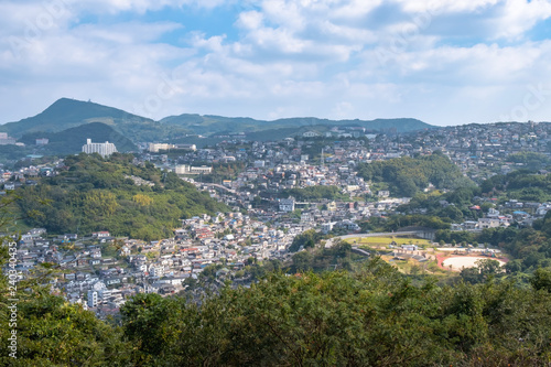 Panorama view of Nagasaki city with montain and blue sky background, Cityscape, Nagasaki, Kyushu, Japan