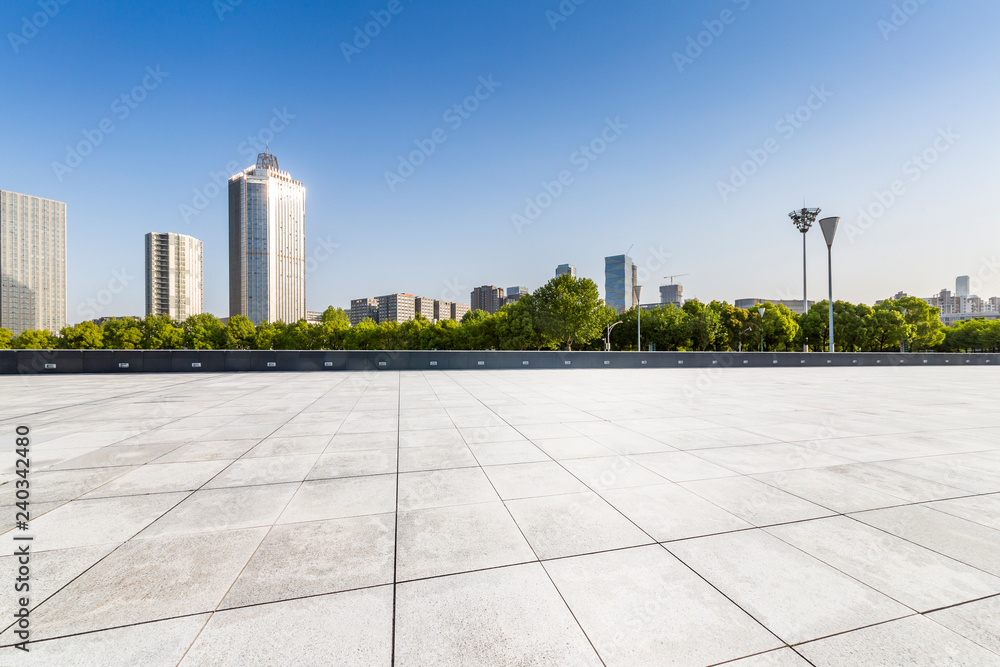 Panoramic skyline and modern business office buildings with empty road,empty concrete square floor Panoramic skyline and modern business office buildings with empty road,empty concrete square floor