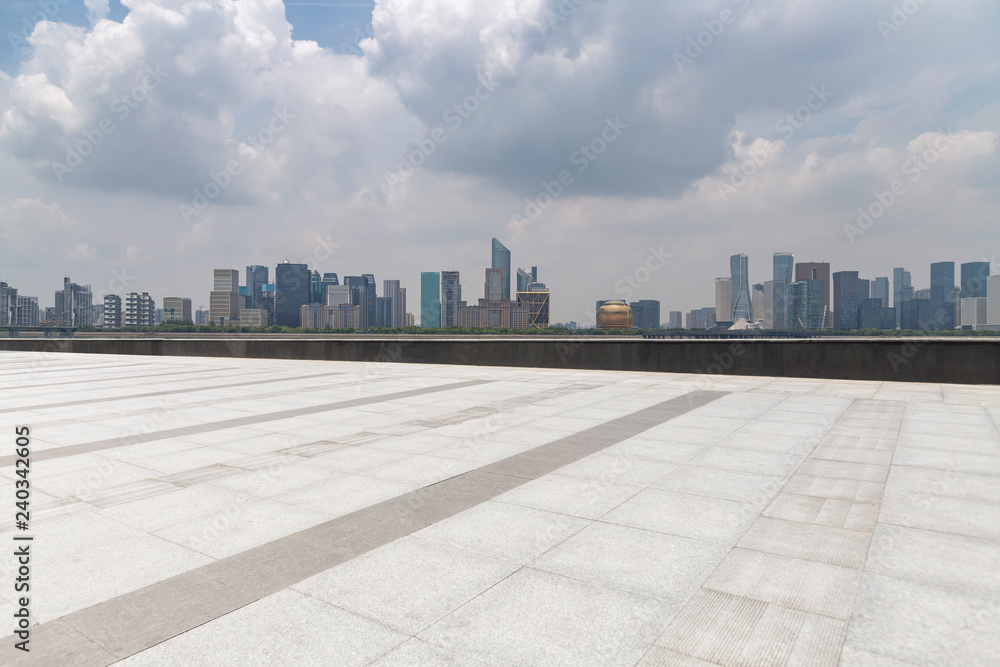 Panoramic skyline and modern business office buildings with empty road,empty concrete square floor Panoramic skyline and modern business office buildings with empty road,empty concrete square floor
