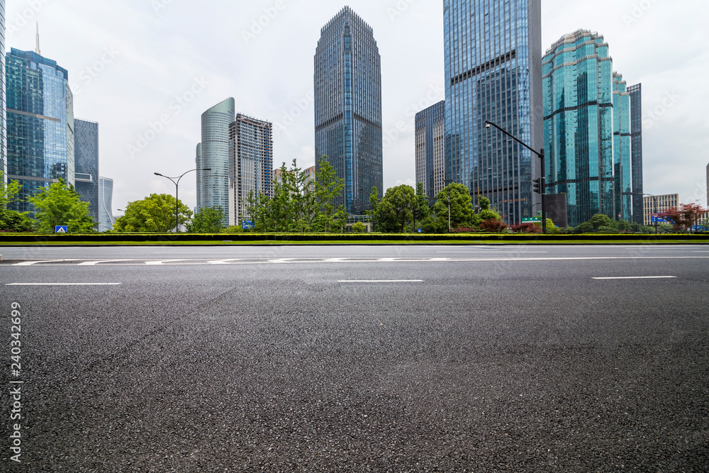 Panoramic skyline and modern business office buildings with empty road,empty concrete square floor