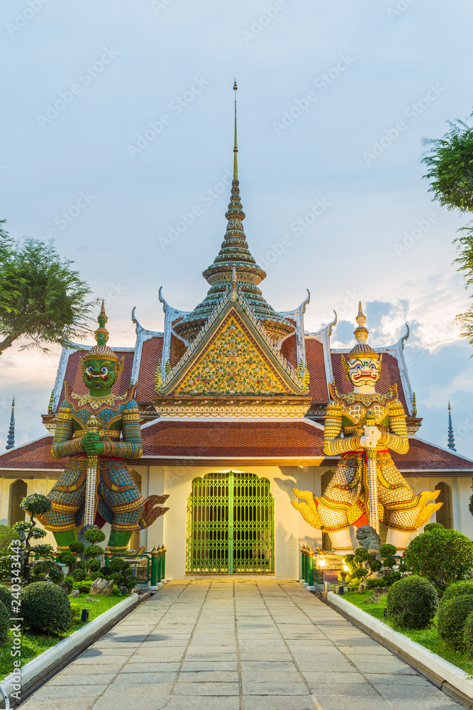 Two of famous giant statue at the gate of Wat Arun Bangkok Thailand