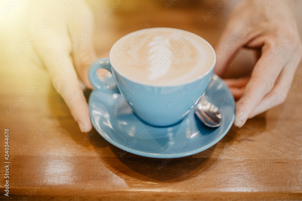 Close-up of man hands preparing coffee in blue cup Close-up of man hands preparing coffee in blue cup