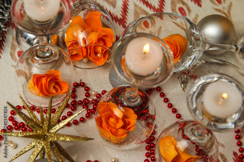 Romantic composition with wine glasses and fake flowers