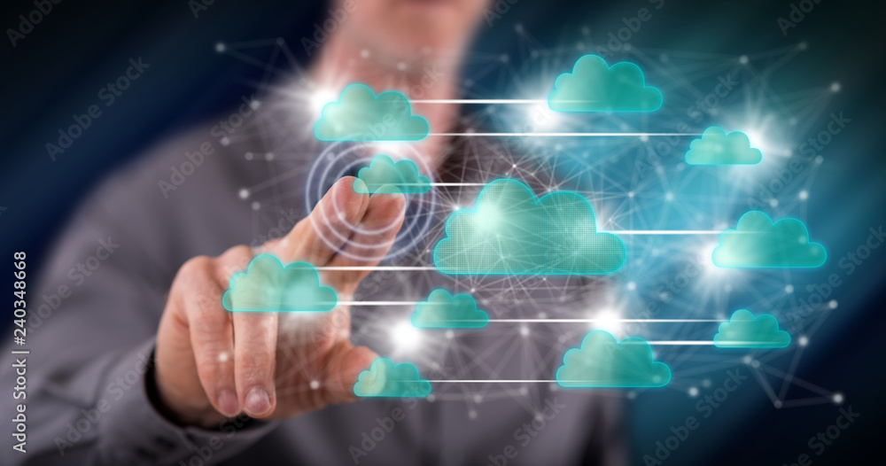 Man touching a cloud networking concept Man touching a cloud networking concept