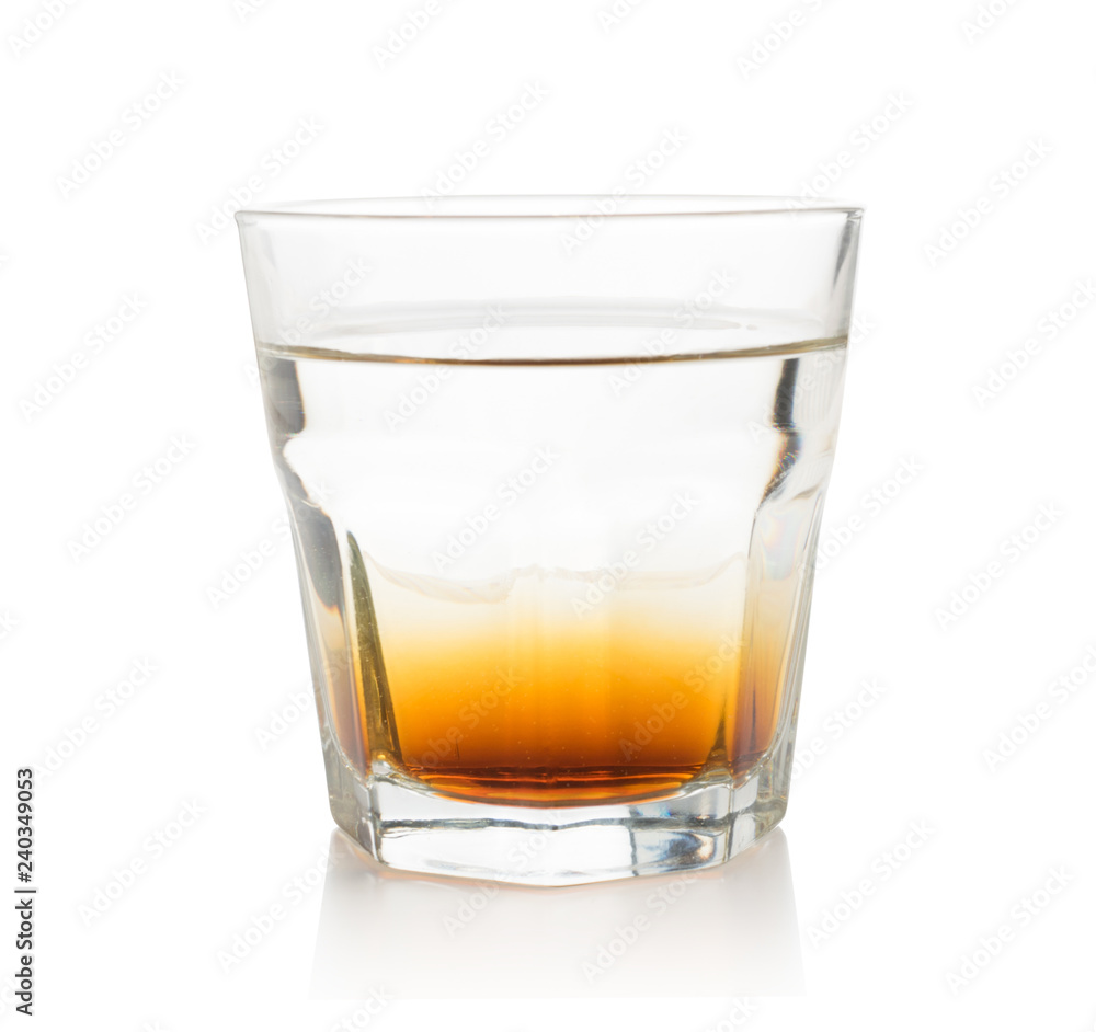 Double layer alcoholic cocktail in transparent glass isolated Double layer alcoholic cocktail in transparent glass isolated