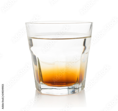 Double layer alcoholic cocktail in transparent glass isolated