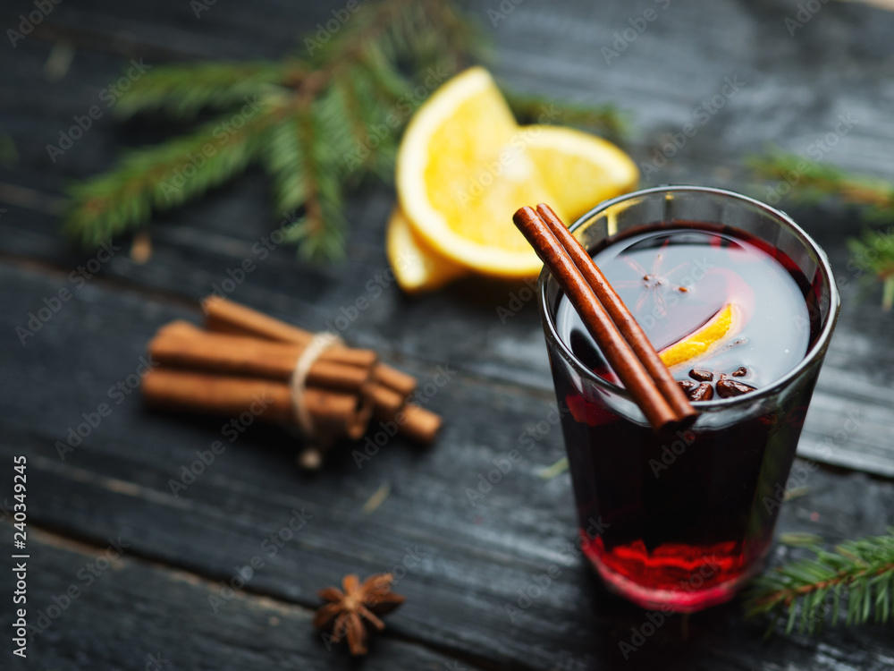A mug of mulled wine with cinnamon, anise and citrus