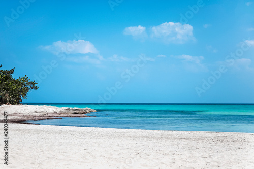 Caribbean turquoise sea beach shore with white sand, stunning view under blue sky. Varadero Beach, Cuba. Outdoors, copy space.