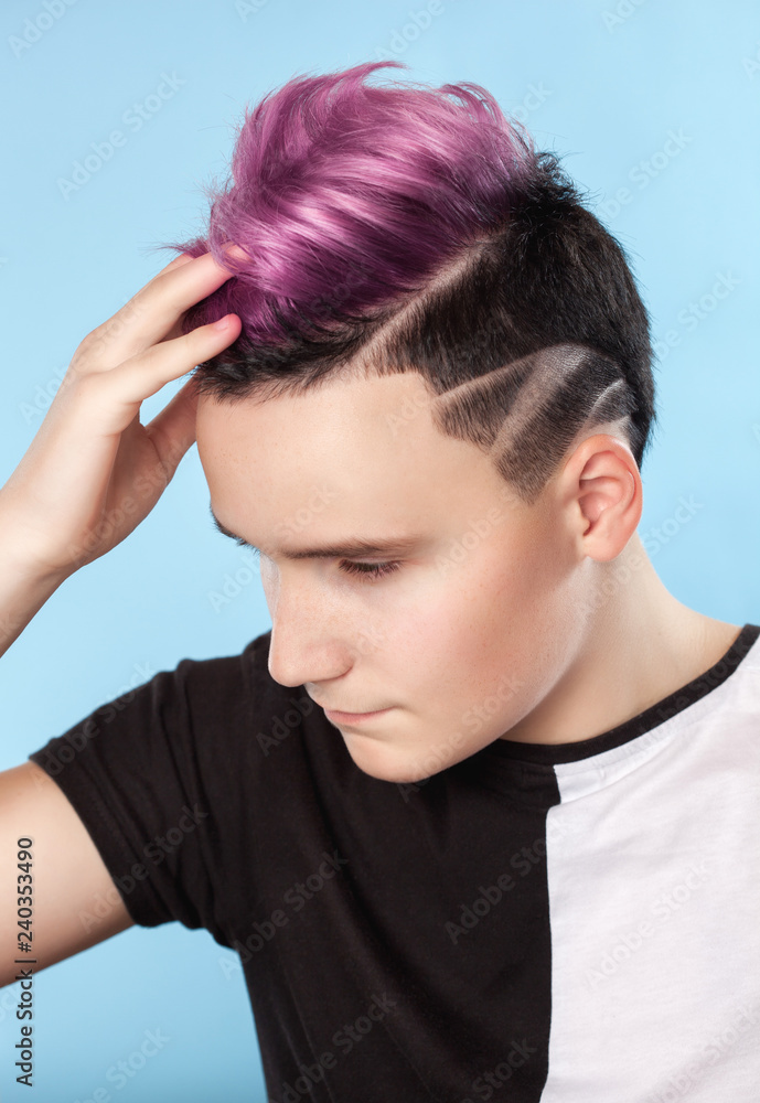 Portrait of a beautiful young teenager with a beautiful creative hairstyle, hair painted in pink. Portrait of a beautiful young teenager with a beautiful creative hairstyle, hair painted in pink.